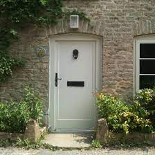 3' x 8' knotty alder entry door with wrap around transom and sidelights. Traditional Front Doors Ideal Home