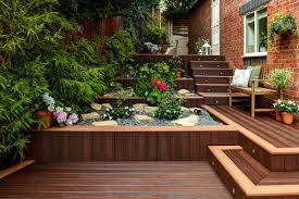 Pin By Jamie Valle On The Out Of Doors Small Patio Garden Sloped Garden Deck Design