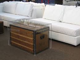 Functional lucite trunk with hinged lid fully transparent polished chrome handles and accents. A Louis Vuitton Trunk Encased In Acrylic