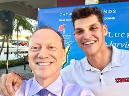 His Excellency Governor Martyn Roper gives a shout out to young Caymanian  golfer Aaron Jarvis, after Jarvis makes the cut at the British Open at St  Andrews in Scotland.