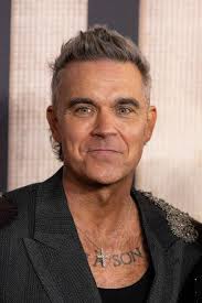 Robbie Williams photographed with his good friend (also a film director)  Stephen Ward last night… From Stephen Ward's page: 'Went to a screening of  Better Man, the highly unusual and brilliant biopic