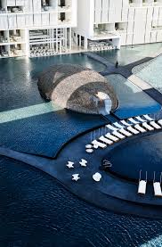 To Lead The Way Into A Dining Area A Ramp Also Spirals Down Between The Pools Hotel Landscape Water Architecture Pool Designs