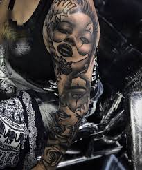 Word 'lame' inked in a distorted font on the arm. Chicano Tattoo