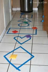 Shape Toss Hop Skip And Jump From Learn Play Imagine Preschool Math Games Teaching Shapes Learning Shapes