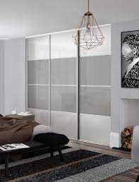 White bedroom wardrobe cabinets can add a beautiful touch to your bedrooms. Classic 4 Panel Sliding Wardrobe Doors In Pure White And Light Grey Glass With Silver Frame Sliding Wardrobe Doors Wardrobe Doors Sliding Wardrobe