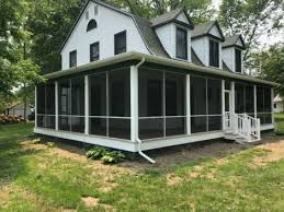 This stunning covered front porch is built with low maintenance vinyl products from the gray azek decking, white columns, and railings to the white beadboard ceilings and wood beams wrapped in pvc. Extended Height Wrap Around Screen Wall Porch Screen Tight