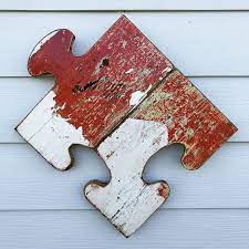 For a more traditional space, try metal wall decorations with an intricate design, like a tree. Reclaimed Wood Puzzle Piece Sign Rustic Decor Recycled Wood Etsy Recycled Wood Decor Wood Puzzles Wood Wall Art