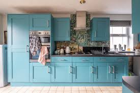 A Book Filled Maximalist Home Has Must See Blue Kitchen Cabinets Blue Kitchen Cabinets Blue Kitchens Kitchen Cabinets