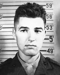 This well-known photograph of Private Theodore J. Miller was widely  circulated in the United States after his death, becoming one of the few  images to openly depict the intense stress of combat