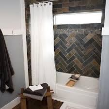 The countertop is one block of marble with a large vein running through it. Slate Tile Border Design Ideas