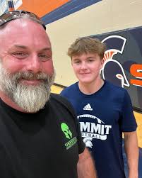 It's called the “Rite of Passage”. This is our third and final year to take  part in this father/son football tradition at Summit High. Before the first  game, the team and families