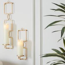 Decorate with your flower arrangements as usual and watch your guests' eyes twinkle. Home Decorators Collection Gold Metal Wall Sconce Candle Holder Set Of 2 13886 01hd The Home Depot