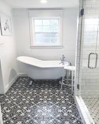 Black And White Tile Bathroom Shower The Vintage Black And White Patterned Tile Adds An Extra Touch Of Character To This Beautiful Farmhouse Bat Black Bathroom Black Tile Bathrooms Trendy Bathroom