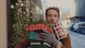 Man is Hurry Up , Running on the Street Holding Many Christmas Gifts for  His Family and One Falls. Caucasian Man Rushly Stock Footage - Video of  decorations, caucasian: 258676390