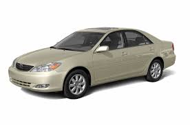 Cloth door trim w/integrated armrest, dual front/rear map pockets. 2003 Toyota Camry Le 4dr Sedan Specs And Prices