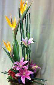 Bamboo Powerful Birds Of Paradise Pink Asiatic Lilies Red Alstromeria Tropical Floral Arrangements Creative Flower Arrangements Church Flower Arrangements