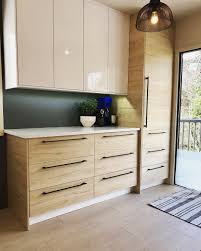 Taking Advantage Of Wall Space With Ikea S Ringhult High Gloss Uppers And Askersund Light Ash Lowers Ash Kitchen Cabinets Ikea Kitchen Upper Kitchen Cabinets