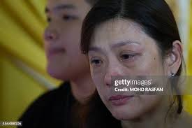 Ivy Loi wife of Malaysia Airlines pilot, Eugene Choo, one of the... News  Photo