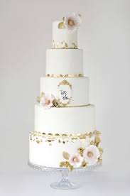 Grand Gold And White Wedding Cake With Gold Leaf Wedding Cake Gold Leaf Gold Wedding Cake Wedding Cake Designs
