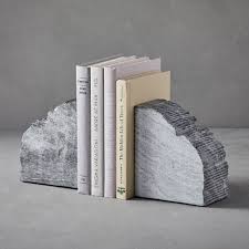 Once you have rough cut your shape with the chainsaw, there are other carving tools that will allow you to get the deep curves and cuts that a scupture will require. Rough Cut Stone Bookends Decorative Accents