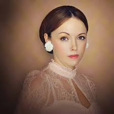 Mariya Ray Photographer added a...