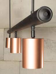 Copper Spotlights Hung From A Matt Black Bar Copper Lighting Black Bar Copper House