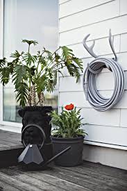 Designer Garden Hose In 2020 Garden Hose Holder Garden Design Garden Hose