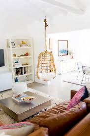 To take advantage of the views from the master bedroom, the designer had a freestanding headboard wall created to move the custom verellen bed closer to the windows, near which she hung a serena & lily rattan chair. Living Room Hanging Chair Layjao