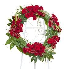 A collection of funeral flowers and wreaths for cremation urns and memorial services. The Fascinating History Of Funeral Wreaths Scent And Violet