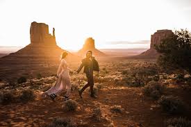 It has a road going through these incredible rock formations, and you can stop at the top of a hill and take this iconic photo. Stylish Western Engagement Session In Monument Valley Utah Elopement Photographer The Hearnes Adventure Wedding Elopement Photographers In Moab Alaska And Beyond