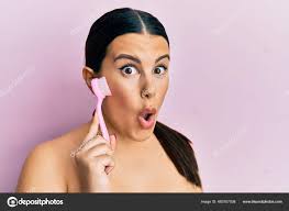 Beautiful Brunette Woman Using Facial Exfoliating Brush Scared Amazed Open  Stock Photo by ©Krakenimages.com 483707038