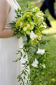Megan and drew held an unusual and special wedding ceremony that was meaningful to them both. Green Bridal Bouquet With A Few White Accent Flowers Gorgeous Green Wedding Bouquet Wedding Flower Trends Cascading Bridal Bouquets