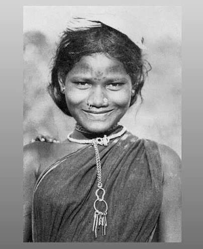 1940-80s :: Woman of Gond Tribe of the Adilabad highlands in present day Telangana. Her forehead is tattooed, and suspended from a solid silver necklace is a bundle of keys. Gond wives