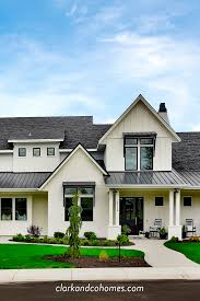 Black And White Awnings For Windows The Heartland The Exterior Of This Modern Farmhouse Home Features Black Windows Metal Awn Brick Exterior House Black House Exterior Modern Farmhouse Exterior