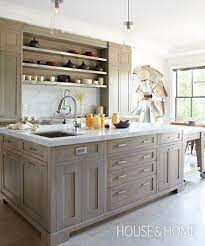 Stained kitchen cabinets, you want to take into consideration the cost as well as how paint vs. In This Kitchen Birch Cabinets Get A Modern Finish With Grey Stain Honed Limestone Floors Stained Kitchen Cabinets Modern Grey Kitchen Wood Kitchen Cabinets