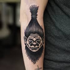 Who is the owner of shrunken head tattoo shop? Philip Yarnell