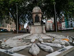 100 human figures placed in front of Colston statue in city centre ...