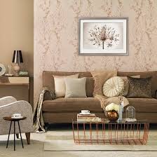The striped rug incorporates several gold tones of caramel, topaz, and wheat, pulling the room together. Rose Gold Living Room Living Room Decorating Ideas Ideal Home Gold Living Room Brown And Gold Living Room Brown Living Room Decor