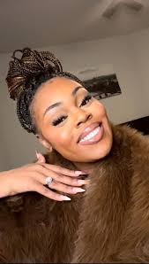 Can someone edit this photo into a headshot?