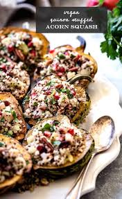 Roasted Acorn Squash Filled With Hearty And Gluten Free Quinoa Stuffing Flavored With Cranberries Vegan Acorn Squash Recipes Acorn Squash Recipes Acorn Squash