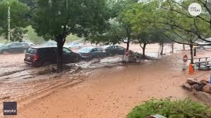 Flood waters poured through the streets. Zion National Park Begins Clean Up After Dramatic Flash Flooding