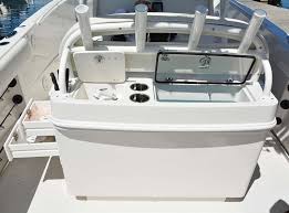 Sailfish 270cc Either The Bench Seat Shown Or Twin Deluxe Captain S Chairs Can Be Installed Atop This Livewell And Tackle Center Though The Four Rod Rocket