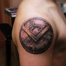 An illustration of a muscular strong trojan or spartan. Shield Tattoo Meanings Itattoodesigns Com Shield Tattoo Spartan Tattoo Tattoos With Meaning