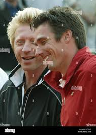 Veteran German tennis players Michael Stich, right, and Boris Becker smile  during the opening ceremony of the Baron von Cramm Trophy, a Davis Cup  revival tournament, at the center court in Hamburg-Rothenbaum,