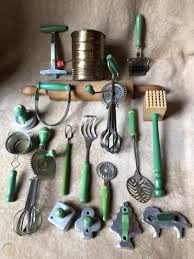 This one takes the shape of a more traditional strainer, with plastic handles and a silicone base. Vtg Antique Lot 16 Green 1 Red Handle Kitchen Tools Utensil Wooden Metal Roll 1889293544
