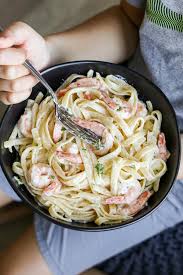 Shrimp scampi is typically shrimp sauteed with a lemon, white wine, garlic, buttery sauce, served (most of the time) over pasta. Creamy Shrimp Scampi Momsdish