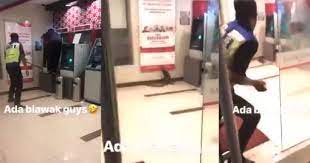 5515 7500 4299 cimb islamic: Watch Nervous Cops Try To Eject Monitor Lizard From Bank Islam Branch Fail Miserably