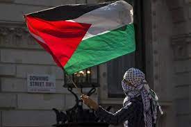 The palestinian flag is a horizontal 3 color with a red triangle on the left side of the flag. Palestinian Flag Allowed To Fly At U N Wsj
