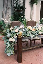 Lush Garland With Flowers Added Flower Centerpieces Wedding Wedding Table Designs Lush Garlands