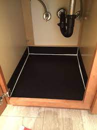 Check the sealant around the sink drain and faucet for any faulty caulk. Tap Carries A Variety Of Materials That Can Be Used To Line Cabinets Under Sinks To Protect Fr Under Kitchen Sinks Kitchen Sink Storage Inside Kitchen Cabinets